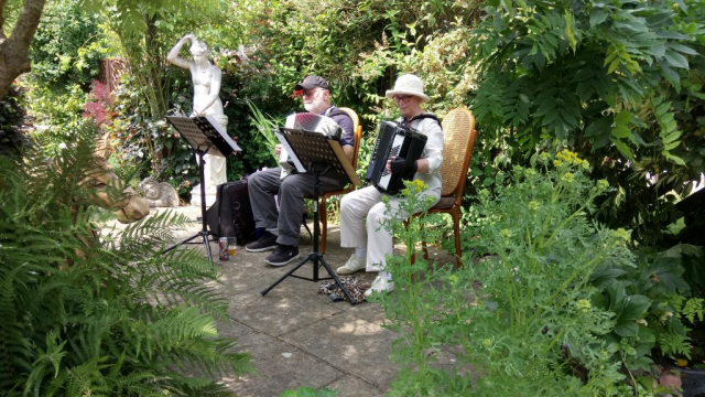 Freda and Ivan on accordion performing at Music In The Garden