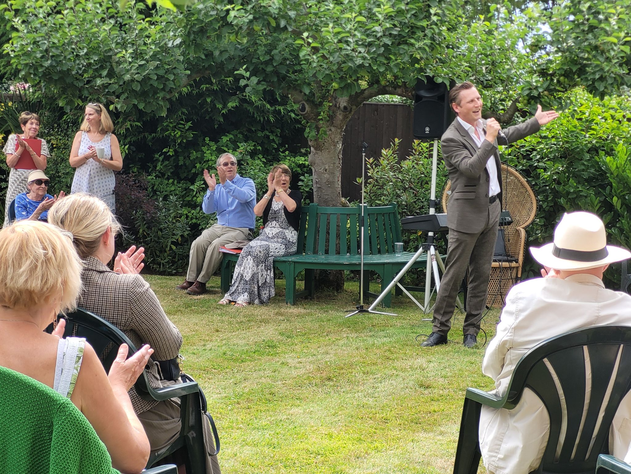 Georg Tormann singing at the Music in the garden event